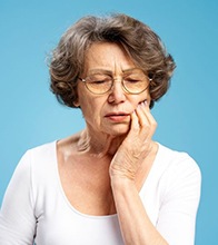 Senior woman experiencing mouth pain